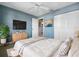 Serene bedroom with blue walls, neutral bedding, and ample closet space creates a relaxing retreat at 6507 Stone River Rd # 310, Bradenton, FL 34203