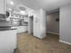 Bright kitchen with white cabinetry, subway tile backsplash, and updated appliances; seamlessly connects to the dining area at 6507 Stone River Rd # 310, Bradenton, FL 34203