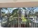 Screened patio offering picturesque views of lush greenery, mature trees, and blue skies at 6507 Stone River Rd # 310, Bradenton, FL 34203