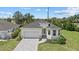Aerial view of charming single-Gathering home and manicured front lawn at 7443 S Seagrape Rd, Punta Gorda, FL 33955