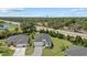 Charming single-Gathering home featuring a gray roof, lush landscaping and a paved driveway at 7443 S Seagrape Rd, Punta Gorda, FL 33955