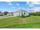 Lovely home featuring an attached two-car garage and well-manicured lawn at 7443 S Seagrape Rd, Punta Gorda, FL 33955