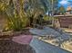 Backyard oasis featuring a wooden swing, paver patio, bar, and lush landscaping at 141 81St N Ave, St Petersburg, FL 33702