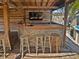 Outdoor bar featuring a TV, barstools, and stone accents at 141 81St N Ave, St Petersburg, FL 33702