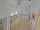 Bedroom shown during remodeling stages, with tile floor, window, and fan at 141 81St N Ave, St Petersburg, FL 33702
