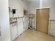 Laundry room shown during remodeling stages, with tile floor and door at 141 81St N Ave, St Petersburg, FL 33702