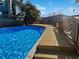 Backyard inground pool with wooden deck and serene outdoor space at 141 81St N Ave, St Petersburg, FL 33702