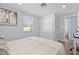 Cozy bedroom features a comfortable bed, closet, and access to an ensuite bathroom at 1805 Rita St, Sarasota, FL 34231