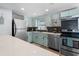 Beautiful kitchen showcasing modern appliances, light colored cabinetry, and plenty of counter space at 1805 Rita St, Sarasota, FL 34231