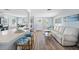 Bright, open-concept living room with modern furnishings and a seamless flow to the kitchen at 1805 Rita St, Sarasota, FL 34231
