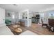 Cozy living room that showcases the bar seating and leads into the kitchen and dining areas at 1805 Rita St, Sarasota, FL 34231