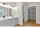 Bathroom featuring double vanity, walk-in closet and shower at 18399 Hillsborough Blvd, Port Charlotte, FL 33954