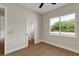 Bedroom featuring a window and an en-suite bathroom at 18399 Hillsborough Blvd, Port Charlotte, FL 33954
