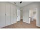 Bright bedroom features hardwood floors and a closet with built-in storage at 18399 Hillsborough Blvd, Port Charlotte, FL 33954