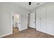 Bright bedroom features hardwood floors and a closet with built-in storage at 18399 Hillsborough Blvd, Port Charlotte, FL 33954