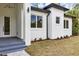 Close-up of the home's entrance with elegant lighting and modern design elements at 18399 Hillsborough Blvd, Port Charlotte, FL 33954