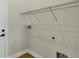 The laundry room features a wire shelf for storage at 18399 Hillsborough Blvd, Port Charlotte, FL 33954
