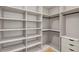 Walk-in closet featuring ample shelving and storage space at 18399 Hillsborough Blvd, Port Charlotte, FL 33954