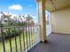 Outdoor balcony with green grass and trees in the background at 8869 White Sage Loop, Lakewood Ranch, FL 34202