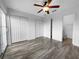 Spacious bedroom with multiple closets, wood floors, and a ceiling fan at 8869 White Sage Loop, Lakewood Ranch, FL 34202
