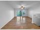 Bonus room featuring wood floors and a sliding glass door to a private balcony at 8869 White Sage Loop, Lakewood Ranch, FL 34202