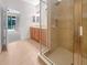 Bathroom features a walk in shower, tile floors, and double sink vanity at 11535 52Nd E Ct, Parrish, FL 34219