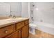 Bathroom features tile floors and shower-tub combo with white tile surround at 11535 52Nd E Ct, Parrish, FL 34219