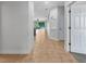 Hallway featuring tile floors and an open view of the living room at 11535 52Nd E Ct, Parrish, FL 34219