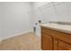 Laundry room has a sink and cabinet storage at 11535 52Nd E Ct, Parrish, FL 34219