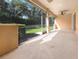 A covered, screened patio that offers a great view of the manicured backyard at 11535 52Nd E Ct, Parrish, FL 34219