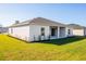 Beautiful backyard featuring a covered patio and freshly landscaped perimeter along the home's rear exterior at 25372 Alicante Dr, Punta Gorda, FL 33955