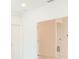 Bright hallway featuring white walls, doors, and marble flooring at 25372 Alicante Dr, Punta Gorda, FL 33955