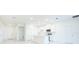 Bright, modern kitchen with white cabinets, a center island, stainless steel appliances, and sleek tile floors at 25372 Alicante Dr, Punta Gorda, FL 33955