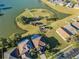 Stunning aerial view of community park with water feature and pool, with lush landscaping at 31028 Baclan Dr, Wesley Chapel, FL 33545