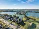 Aerial view of beautiful homes on waterfront lots with stunning lake views at 31028 Baclan Dr, Wesley Chapel, FL 33545