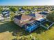 Home features a screened in pool and patio with a spacious backyard at 31028 Baclan Dr, Wesley Chapel, FL 33545