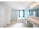 Bright bathroom showcasing a glass-enclosed shower and vanity with a view at 31028 Baclan Dr, Wesley Chapel, FL 33545