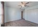 Well-lit bedroom with ceiling fan, closet, and light blue walls for a fresh, airy feel at 31028 Baclan Dr, Wesley Chapel, FL 33545