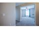 Bright bedroom featuring neutral walls, plush carpeting, and a ceiling fan at 31028 Baclan Dr, Wesley Chapel, FL 33545