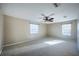 Large, bright bedroom with ceiling fan and bright light filtering through large window, offering a relaxing retreat at 31028 Baclan Dr, Wesley Chapel, FL 33545