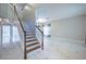 Bright entryway features marble floors, a staircase, and an open concept living space at 31028 Baclan Dr, Wesley Chapel, FL 33545