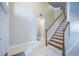 The light and bright entryway showcasing marble floors and a staircase with wood accents at 31028 Baclan Dr, Wesley Chapel, FL 33545