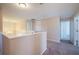 Bright hallway with neutral walls and soft carpeting, connecting various rooms within the home at 31028 Baclan Dr, Wesley Chapel, FL 33545