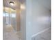 Hallway with marble flooring leads to the front door, featuring an arched entryway at 31028 Baclan Dr, Wesley Chapel, FL 33545