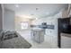 Modern kitchen with white cabinetry, stainless steel appliances, and granite countertops at 31028 Baclan Dr, Wesley Chapel, FL 33545
