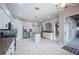 Bright kitchen boasts white cabinets, granite countertops, stainless steel appliances, and an island at 31028 Baclan Dr, Wesley Chapel, FL 33545