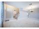Bright and airy living space with marble floors, and an open staircase at 31028 Baclan Dr, Wesley Chapel, FL 33545