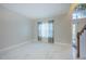 Open-concept living area featuring marble floors, neutral walls, and plenty of natural light at 31028 Baclan Dr, Wesley Chapel, FL 33545