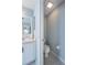 Half bathroom with a toilet and white vanity at 31028 Baclan Dr, Wesley Chapel, FL 33545
