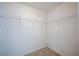 Empty walk-in closet space with carpet and wire shelving at 31028 Baclan Dr, Wesley Chapel, FL 33545